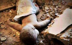 A photo shows a kid Lying on the ground after killed due to Attan attack in 20 April 2015