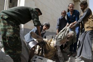 A body being recovered in Sana after the explosion on Monday morning. The blast flattened homes and generated a fireball visible for miles
