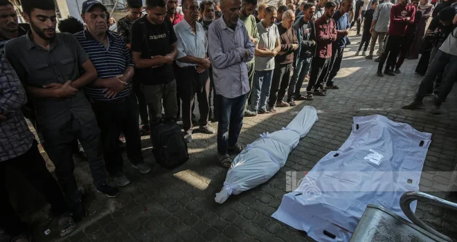 Gaza Civil Defense Transfers Remains of 48 Martyrs from Cemetery Inside Al Maamadani Hospital