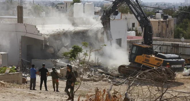 Zionist enemy demolishes houses, Factory, & Industrial Facilities of Palestinians in Hebron